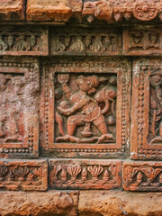 Carved terracotta detail of Ramayana scene with monkey on beautiful ancient temple in Puthia, Rajshahi district, Bangladesh