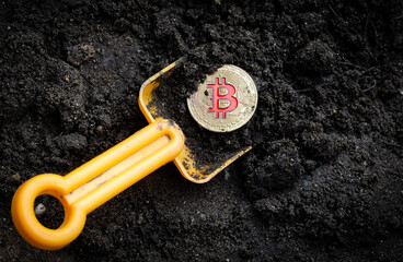 gold coin bitcoin with shovel in soil digital money cryptocurrency concept