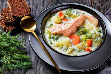 salmon fish soup with cream and veggies, top view