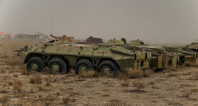 Old armoured vehicles military escorts, guns and tanks in Gardez in Afghanistan