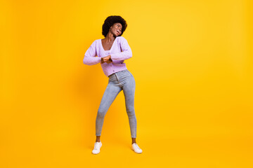 Fototapeta na wymiar Full size photo of attractive dark skin lady dancing look empty space wear violet isolated on yellow color background