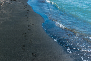 close-up of footprints in the sand on the beach