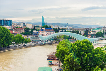 Beautiful view of Kura river and Bridge of Peace in Tbilisi, Georgia © kosmos111