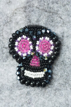 Unfinished brooch skull in style of los muertos made of beads and felt, glass beads and sequins 
