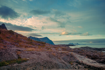 Rocky seashore with cloudy sky. Wilderness. Beautiful nature of Norway. Lofoten islands