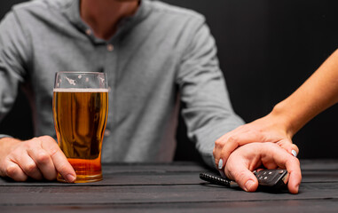 Drunk man with car key and alcoholic beverage in bar, closeup. Don't drink and drive concept