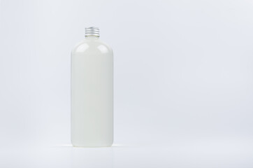 Plastic tall bottle with water, silver cap mockup on white background. Template for portfolio, design, branding identity.