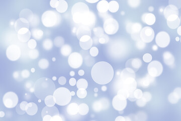 Fototapeta na wymiar Abstract festive gradient light blue gray silver bokeh background texture with white bokeh lights. Beautiful backdrop with space for christmas, invitation or other holidays.
