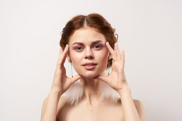 Fototapeta premium woman with bare shoulders jewelry bright makeup freshness cropped view isolated background