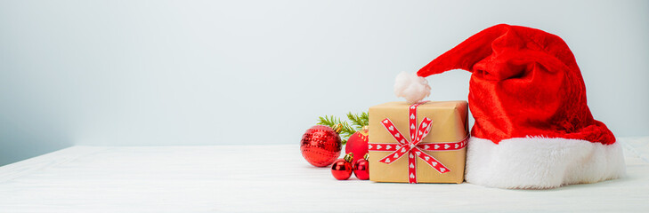 Obraz na płótnie Canvas christmas gift box with santa hat
