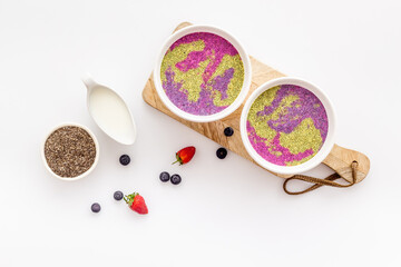 Breakfast smoothie bowles with chia seeds and strawberries, top view