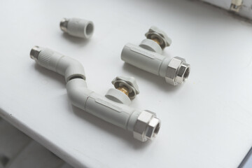 Naklejka premium Modern polypropylene water tap witn and separately polypropylene pipe isolated on white background