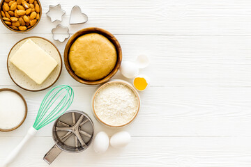 Fototapeta na wymiar Baking homemade cake or cookie - dough in bowl with ingredients, top view