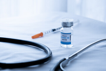 Covid-19 or coronavirus vaccine in glass vials on hospital tables, conceptual medical and...