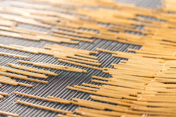 Crunchy bread sticks on conveyor belt at manufacture