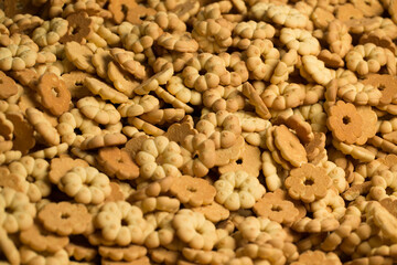 Lots of cookies close up at a factory