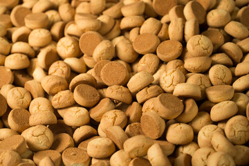 Lots of cookies close up at a factory