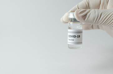 Coronavirus vaccine bottle flipped isolated on black background. Covid-19 situation disease pharmacy in laboratory and drug to cure people.  Healthcare and Medical concept. Development of research.