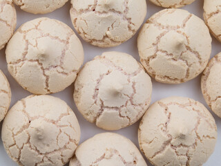 meringues on a white background. pattern. flat lay
