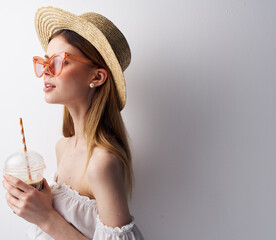 Pretty emotional woman in glass hat with pink glasses luxury Studio drink