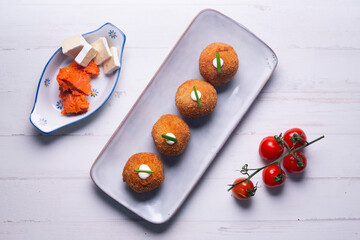 Fototapeta na wymiar Traditional spanish croquettes from mallorca with sobrassada and cheese