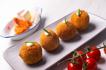 Traditional spanish croquettes from mallorca with sobrassada and cheese