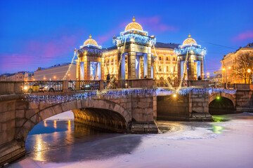 Lomonosov Bridge over the Fontanka River and New Year's decorations in the sky of St. Petersburg