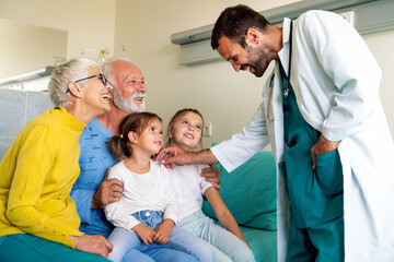 Family visiting mature male patient in hospital. Healthcare, pensioner, family support concept
