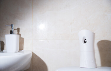 
automatic air freshener in the bathroom
