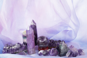 Crystals for healing, tortune telling and astrology. Set of amethyst crystals on purple background