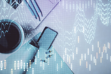 Double exposure of forex graph drawing over desktop background with computer. Concept of financial analysis. Top view.