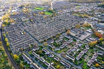 Aerial photo taken in the small town of Shipley in the City of Bradford, West Yorkshire, England showing the autumn fall colours of the hosing estates and roads in the town centre.