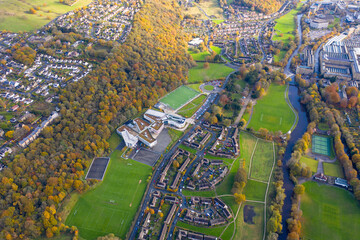 Aerial photo taken in the town of Shipley in Bradford West Yorkshire showing the Leeds & Liverpool canal taken in the Autumn time with brown leafs on the trees.