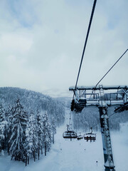 A view from a ski lift on a snowy mountain