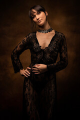 Sexy woman posing in black lace lingerie. The boudoir fantasy image of a sensual beautiful lady has returned to erotic underwear. Hot female model.