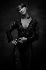 Sexy woman posing in black lace lingerie. The boudoir fantasy image of a sensual beautiful lady has returned to erotic underwear. Hot female model.