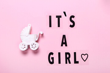 Its a Girl text written on pastel white background top view, Baby announcement. Flat lay,text space. Greeting card, shower, baby concept bright colorful design cute