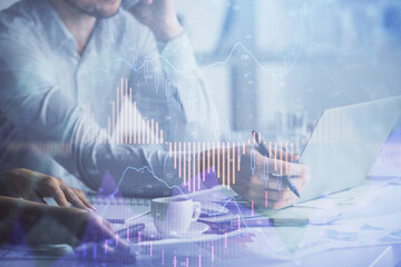 Multi exposure of man and woman working together and financial chart hologram. Business concept. Computer background.