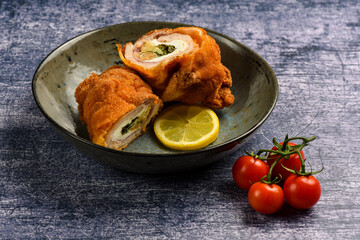Fried  chicken breasts stuffed with ham, mushrooms, green onion