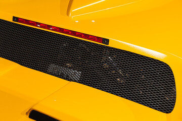 Luxury yellow roadster fragment. Rear ventilation
