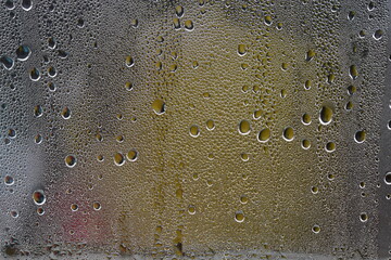 condensation in the form of drops on glass
