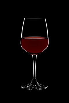 Glass of red wine on black background