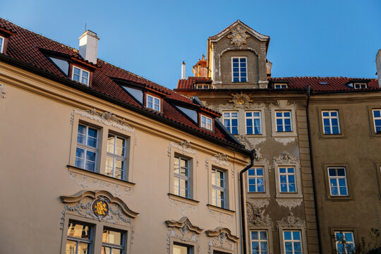 All-seeing eye on the house, narrow picturesque street Jansky vrsek with baroque and renaissance historical buildings, sunny day at Lesser Town, Prague, Czech Republic