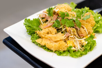 stir fried fish maw on white plate