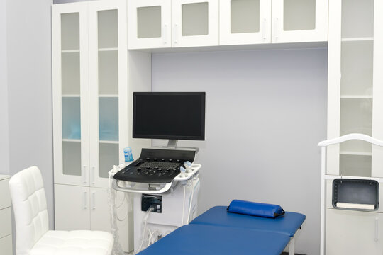 Interior of examination room with ultrasonography machine in hospital laboratory. Modern medical equipment background. Ultra Sound Machine, USG, Sonogram Screening