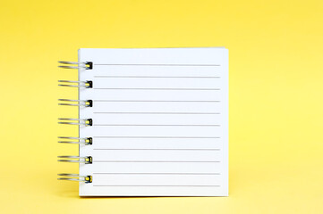 Notebook open on yellow background