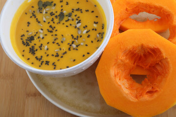 pumpkin cream soup as starter with seeds topping