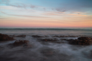 Obraz premium Cloudy sunset on the beach