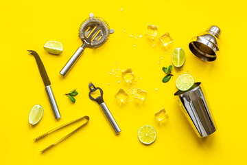 Mojito cocktail set with bar tools and utensils with lime and mint, flat lay