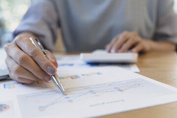 Accounting businesswomen are calculating income-expenditure and analyzing real estate investment data, Dedicated to the progress and growth of the company, Financial and tax systems concept.